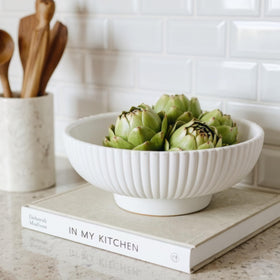 KIBAGA decorative concrete fruit bowl on a modern kitchen counter, highlighting contemporary style and function.