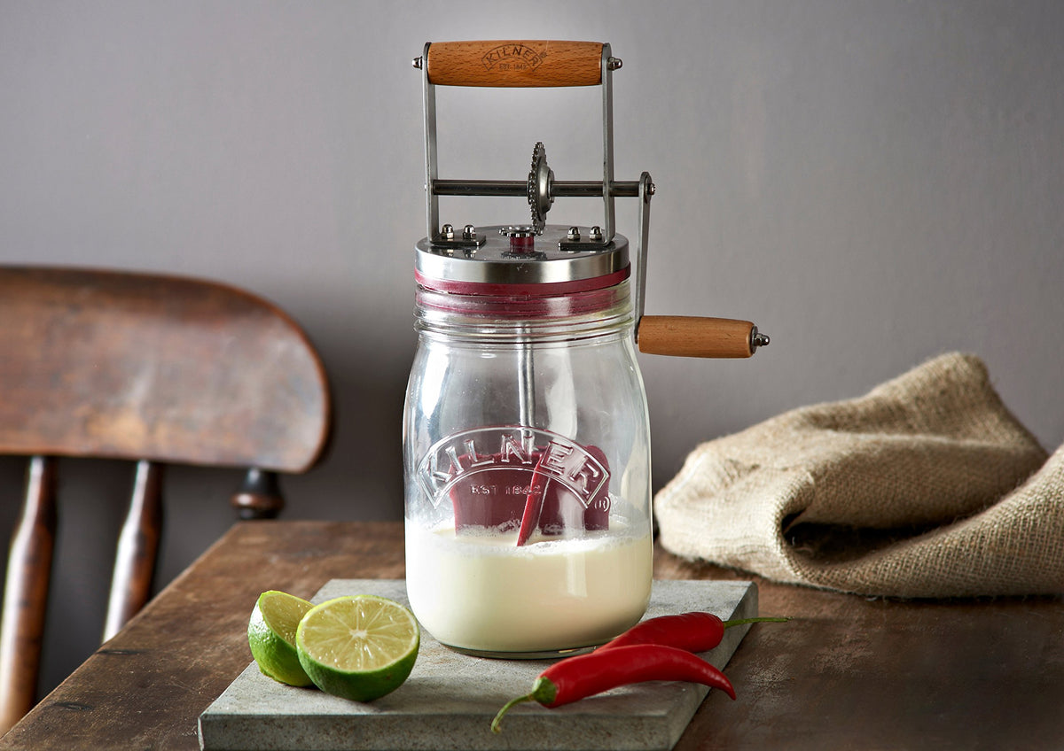 Kilner cream-to-butter action captured, transforming cream into spread in minutes.