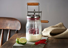 Kilner cream-to-butter action captured, transforming cream into spread in minutes.