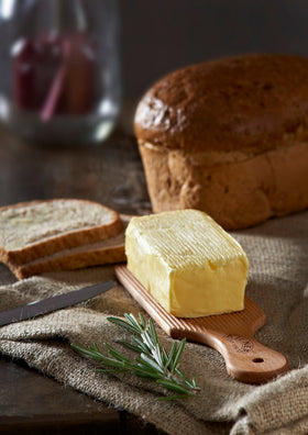 Kilner butter paddles display decorative desserts alongside finished butter.