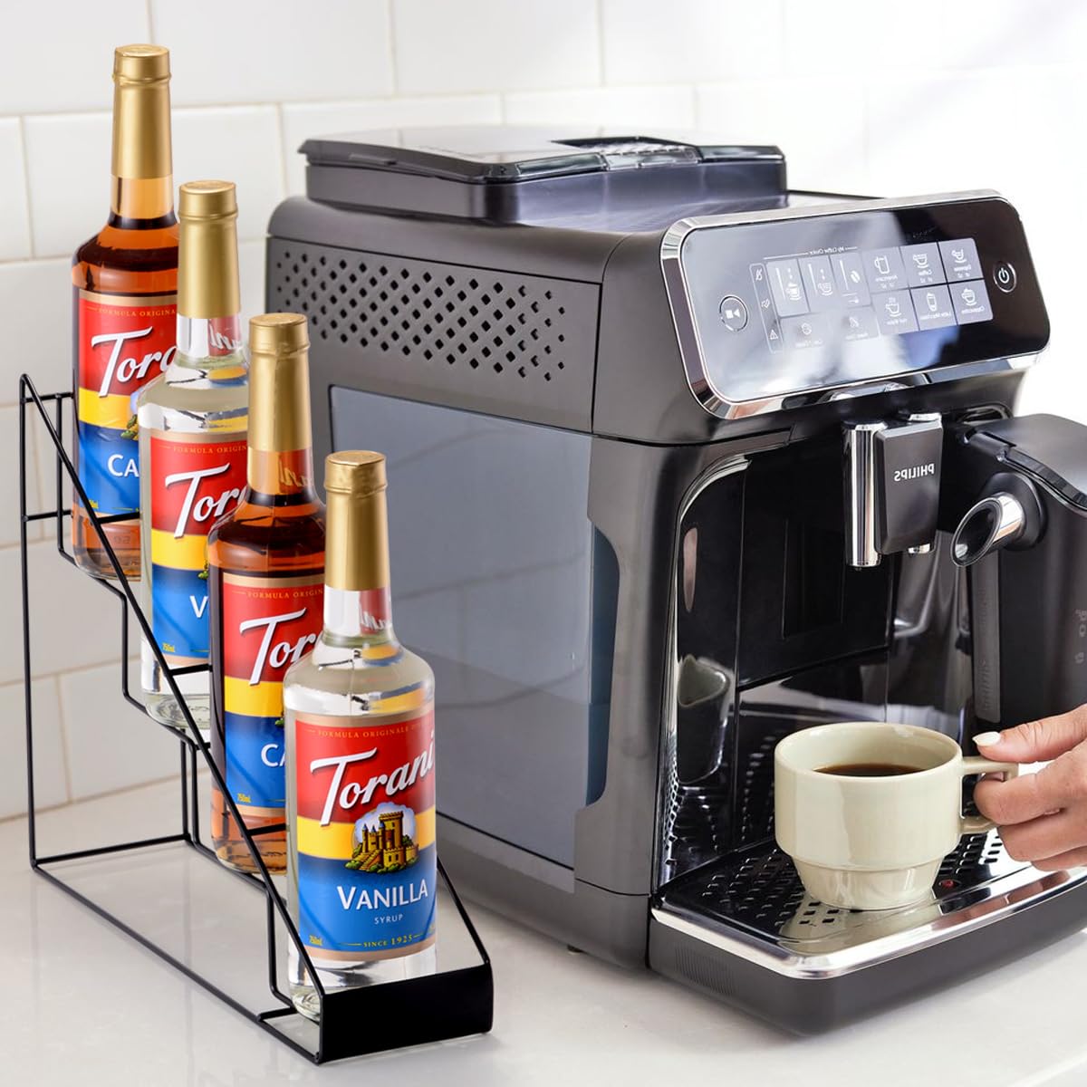 Countertop organization with Torani and Monin bottles ready for use.