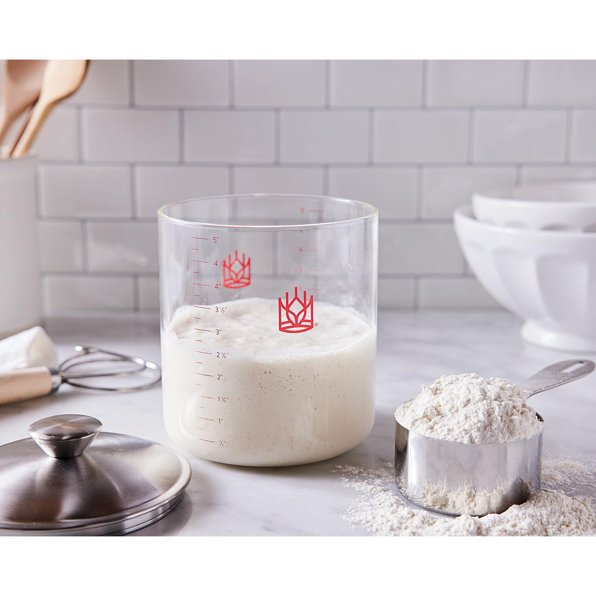King Arthur borosilicate glass with red measurement marks aids feeding schedule.