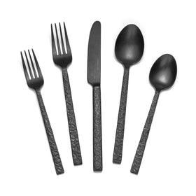 Kingstone 60 piece black hammered silverware on a dining table for family meals