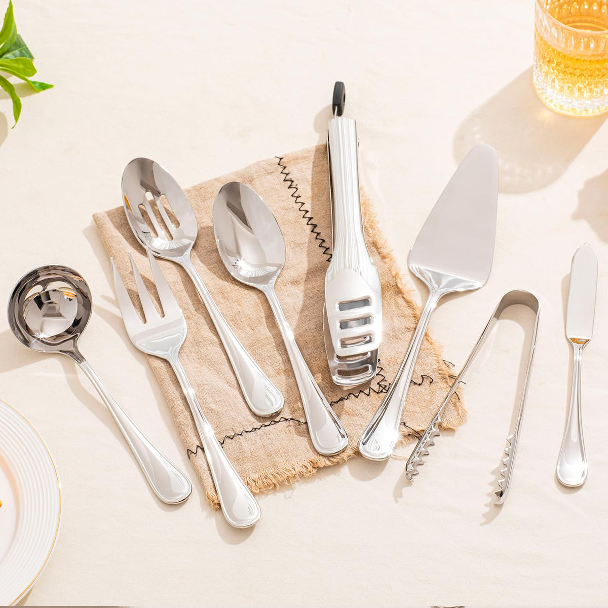 KINGSTONE teardrop serving tongs with comfortable grip for family meals.