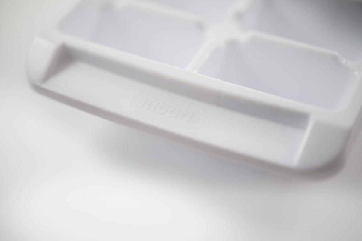 Kitch stackable ice trays neatly fit in the freezer.