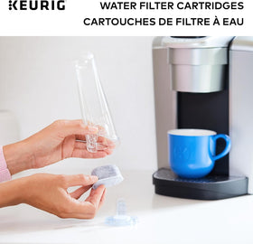 Kitchen counter setup with Keurig and filter handle.