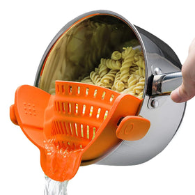 Kitchen Gizmo Snap N Strain clip-on strainer orange close-up for mess-free draining