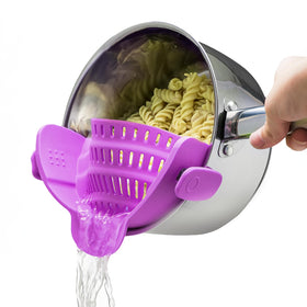 Kitchen Gizmo Snap N Strain clip-on pot strainer attached to a pot for easy draining