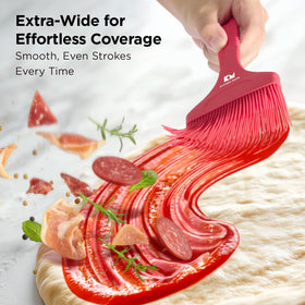 Kitchen Mama Platinum silicone basting brush with ergonomic handle for comfortable, controlled spreading.
