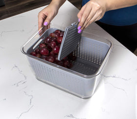 Kitchen Spaces colander lids snap and seal for secure stacking and moisture control.