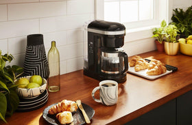 KitchenAid 12-cup coffee maker warming plate keeps coffee warm.