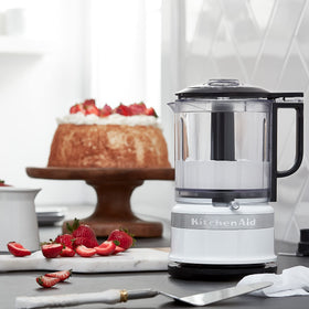 Kitchenaid 5-cup food chopper whisk accessory for whipping cream and blending tasks.