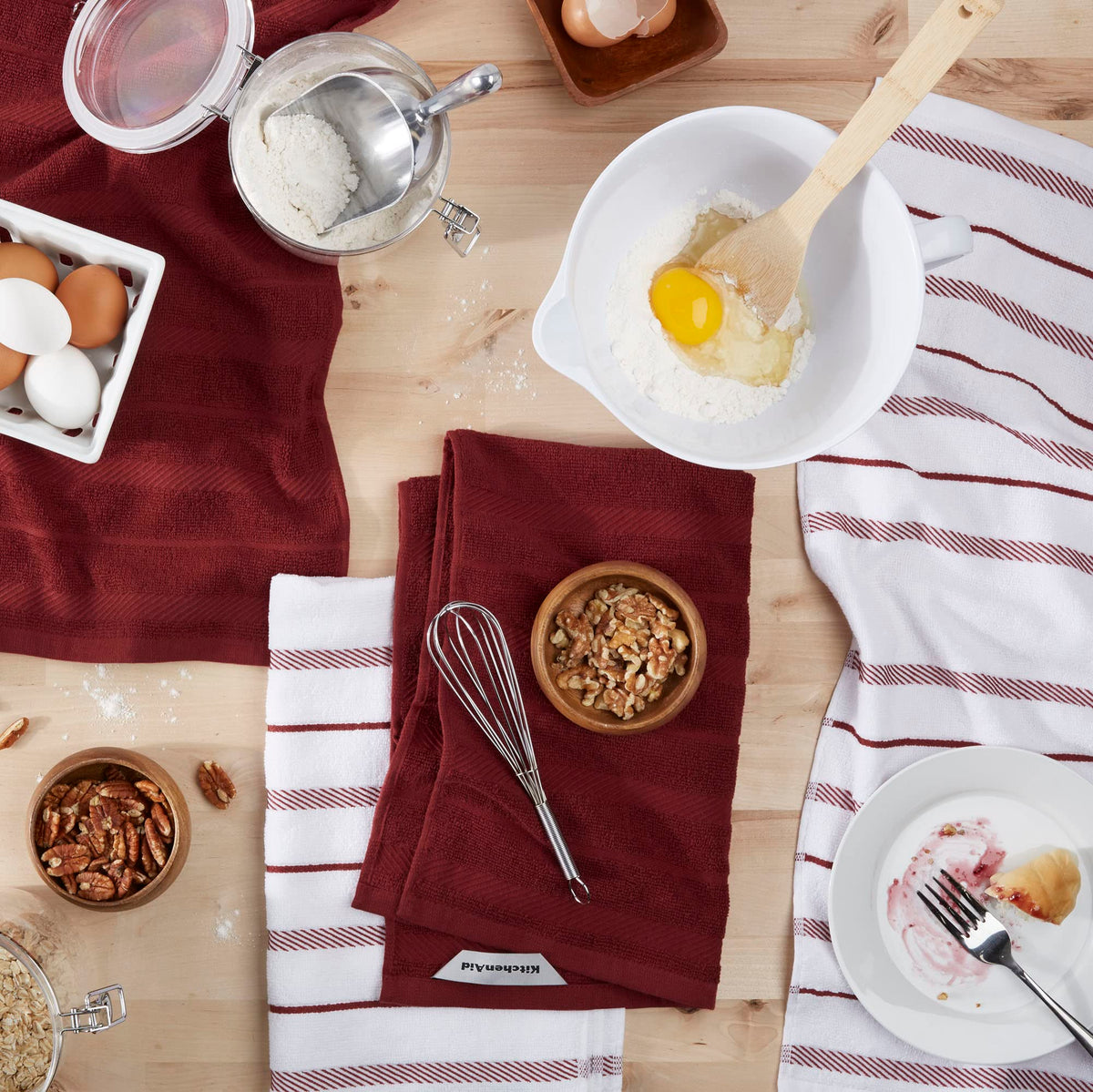 KitchenAid Albany striped towel on a rack, durable cotton-polyester blend.