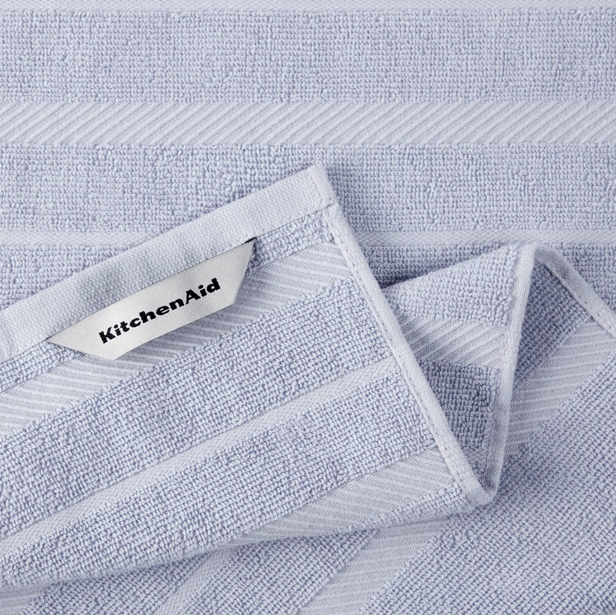 KitchenAid Albany striped lavender-cream towel, versatile for drying and cleanup.