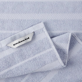KitchenAid Albany striped lavender-cream towel, versatile for drying and cleanup.
