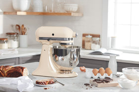KitchenAid Artisan bowl with handle close-up for durable mixing.