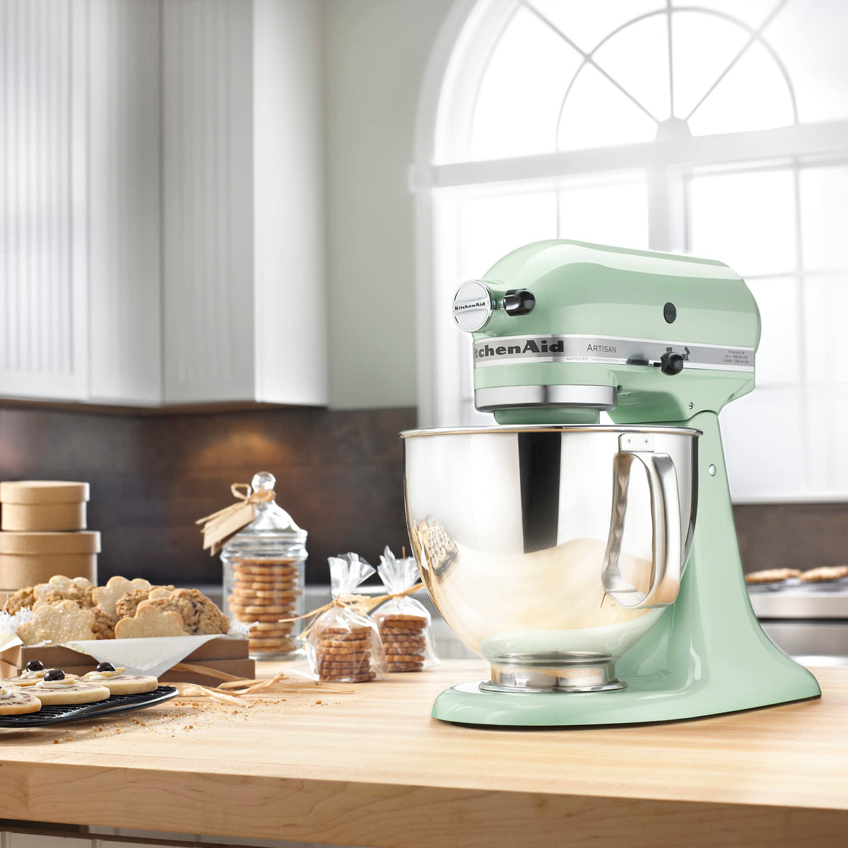 Pouring shield reduces splatter while adding ingredients during mixing