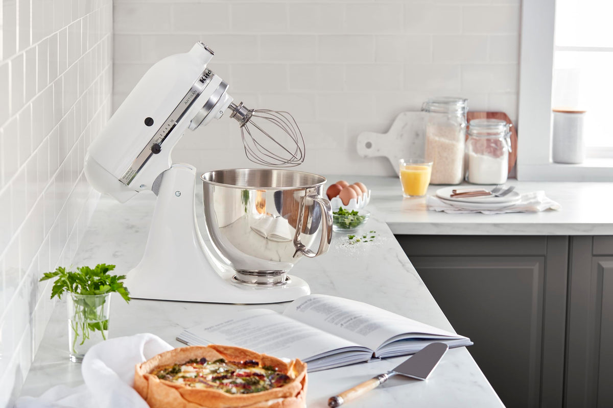 KitchenAid Artisan pouring shield used to prevent splashes during mixing.