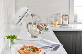 KitchenAid Artisan pouring shield used to prevent splashes during mixing.