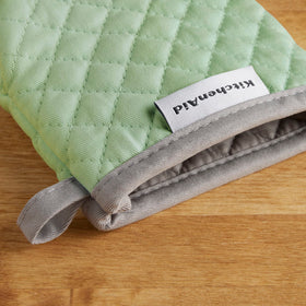Textured silicone grip of KitchenAid Asteroid mini mitts in pistachio color