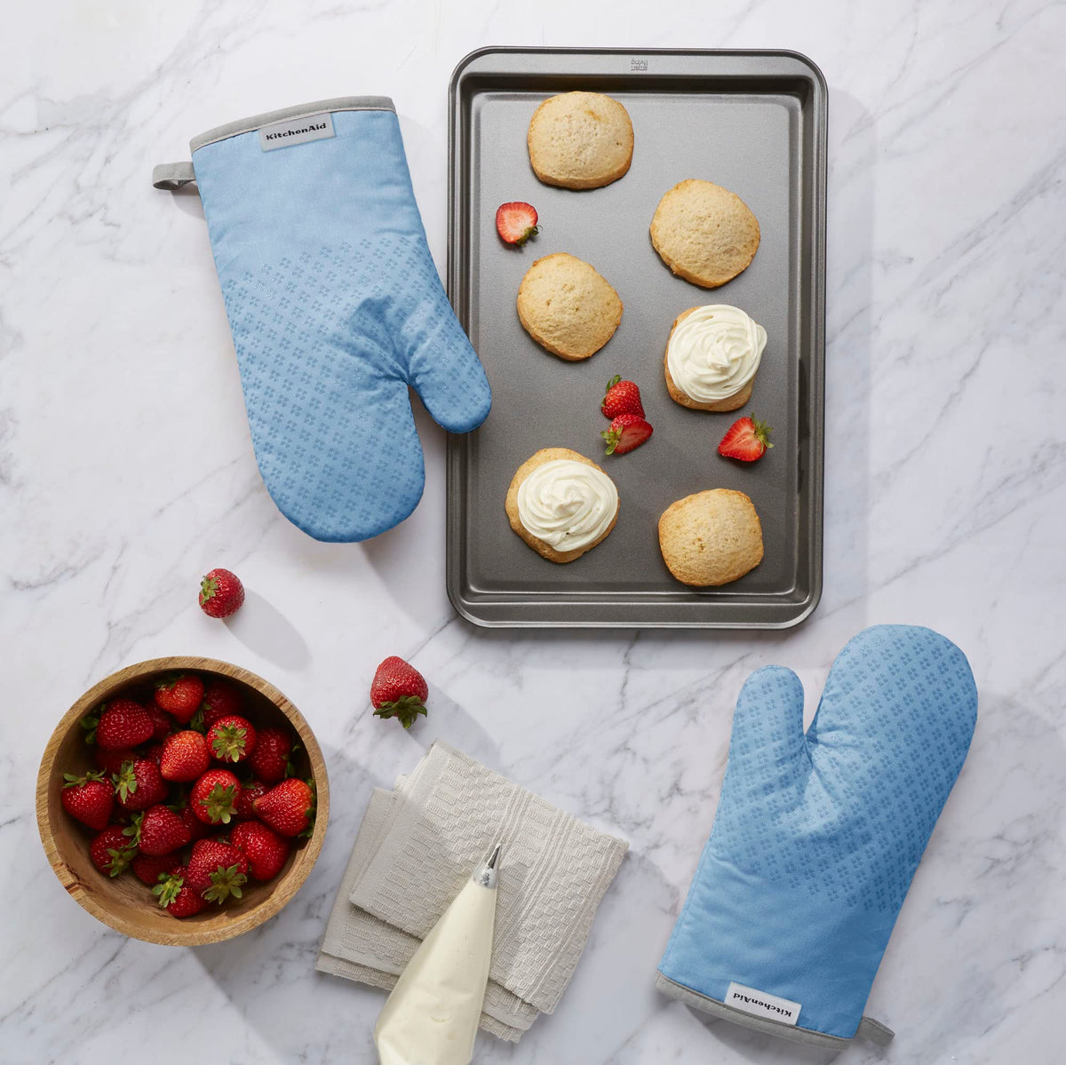 Texture silicone grips on KitchenAid Asteroid Mitt for secure handling of hot cookware.
