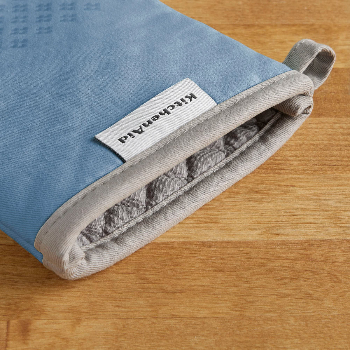 Two-piece KitchenAid Asteroid Mitt set protects both hands during cooking tasks.