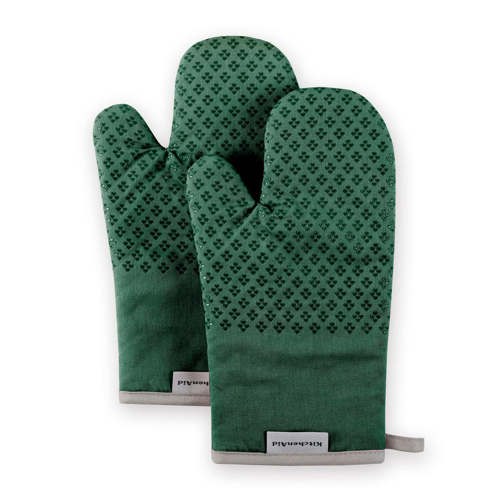 KitchenAid Asteroid oven mitts in dark green provide heat protection up to 302 degrees Fahrenheit.