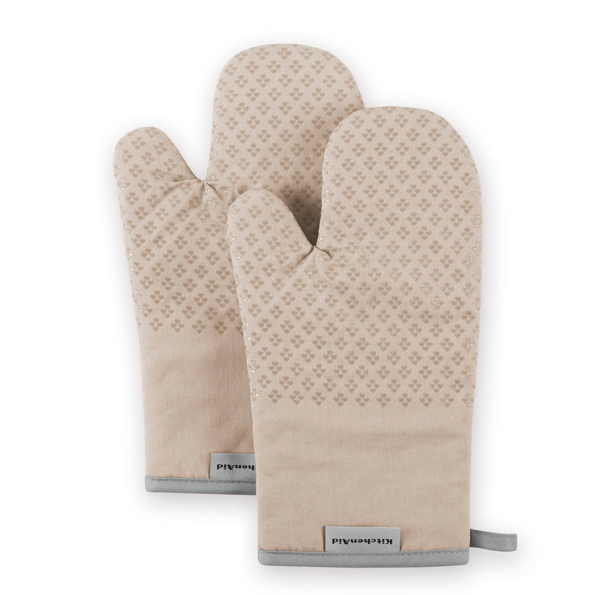 KitchenAid Asteroid Oven Mitts Milkshake Tan 2-piece with heat-resistant silicone grip close-up.