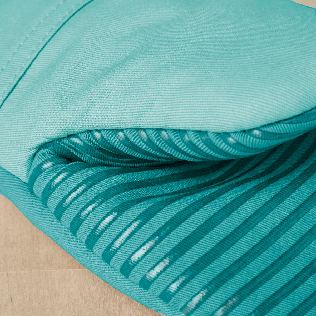 KitchenAid Beacon oven mitt Aqua Sky fabric detail and soft inner lining.