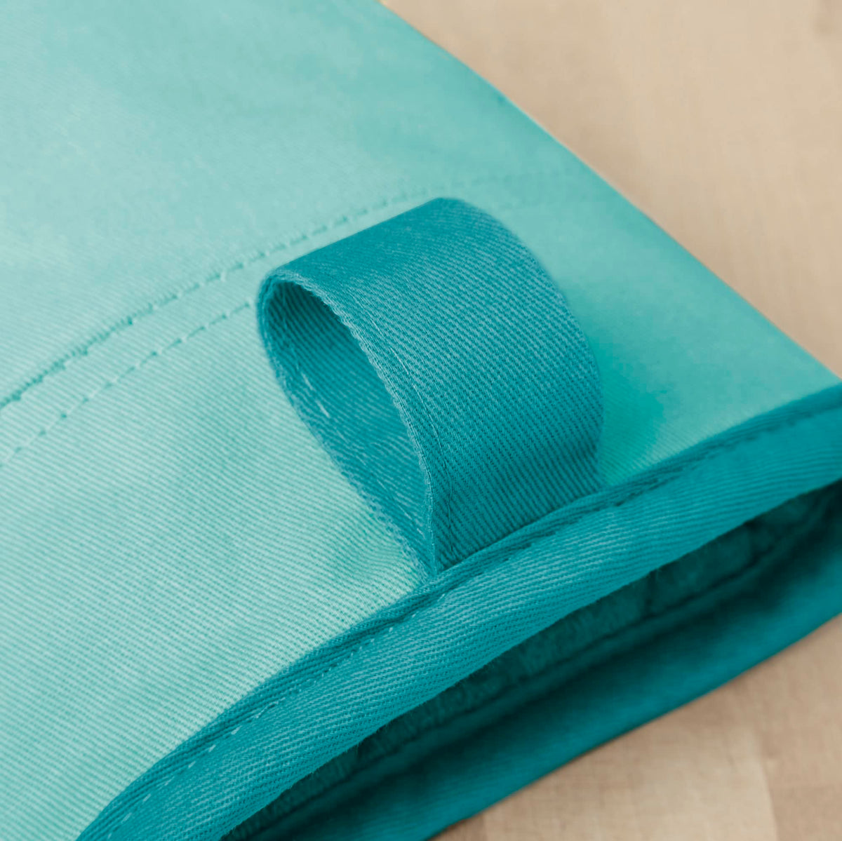 KitchenAid Beacon oven mitt Aqua Sky silicone grip for firm handling of hot cookware.
