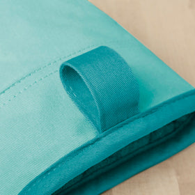 KitchenAid Beacon oven mitt Aqua Sky silicone grip for firm handling of hot cookware.