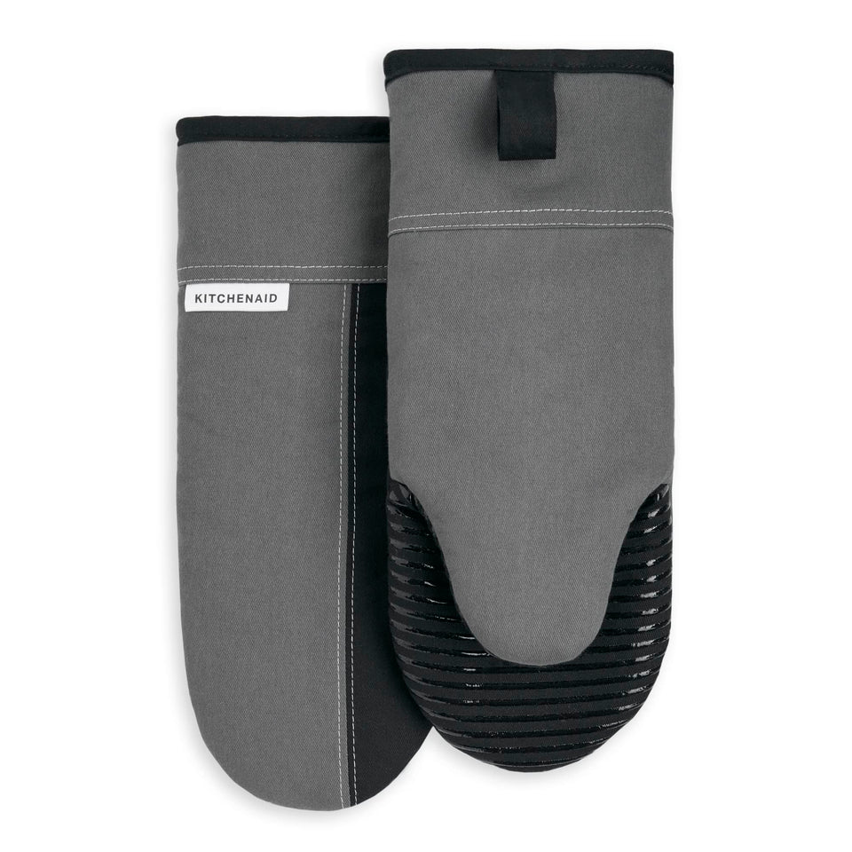 KitchenAid Beacon oven mitt front view shows two-tone contour silver and matte black design for secure handling