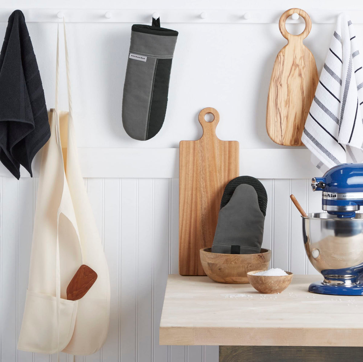 KitchenAid Beacon oven mitt close-up shows slip-resistant silicone grip for safe lifting