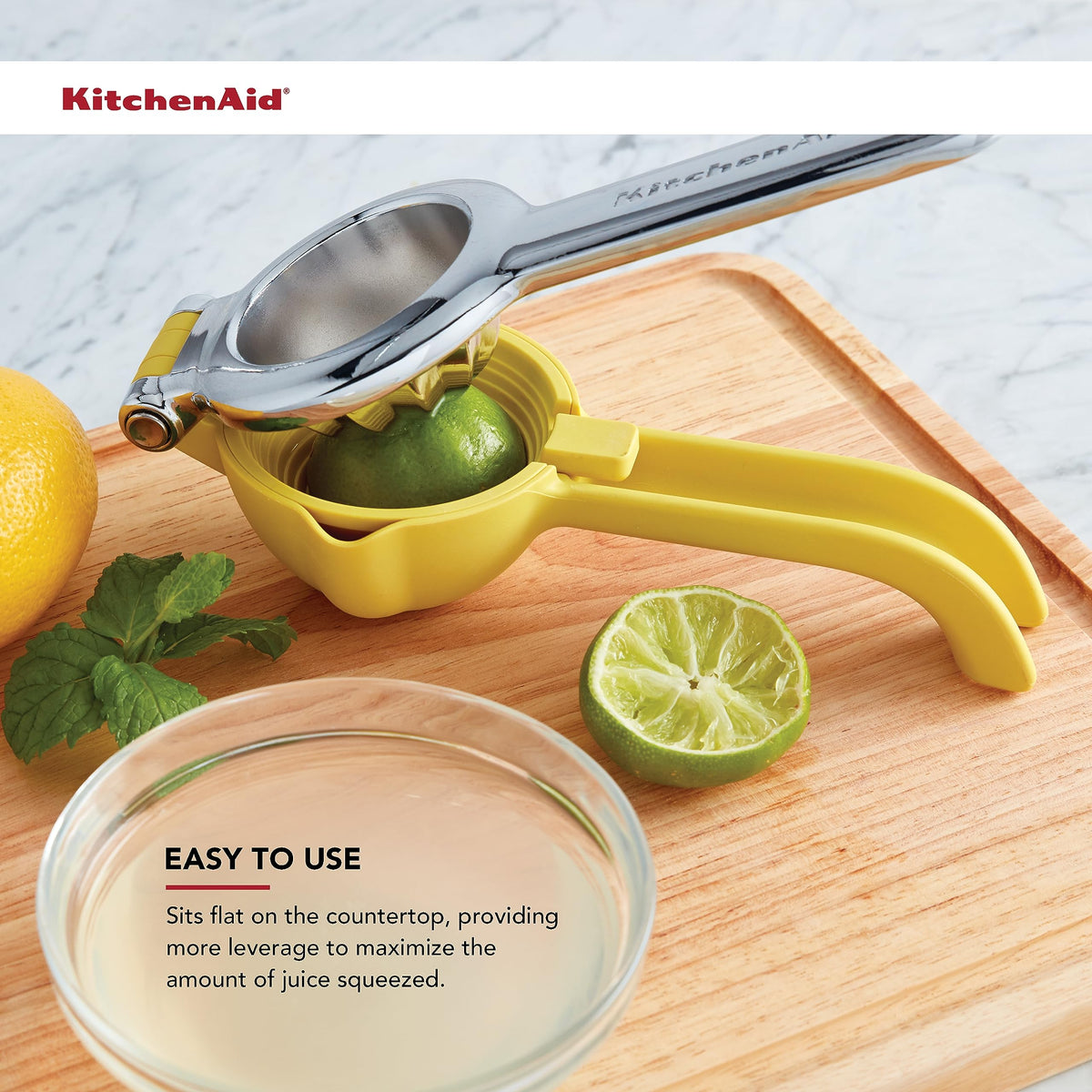 KitchenAid citrus press built-in strainer catches pulp and seeds.