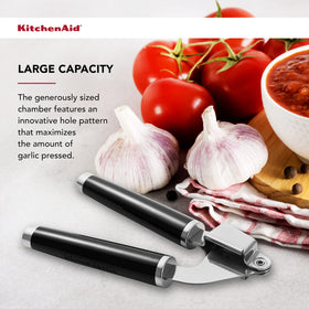 KitchenAid Classic Garlic Press endcap with chrome bolster adds durability.