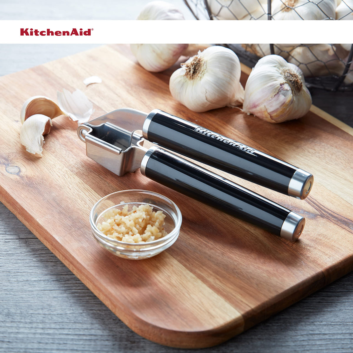 KitchenAid Classic Garlic Press demonstrates pulp and juice extraction.
