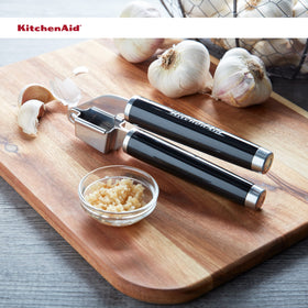 KitchenAid Classic Garlic Press demonstrates pulp and juice extraction.