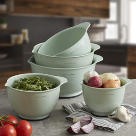 Bowls nest together for compact storage in a KitchenAid Pistachio set.