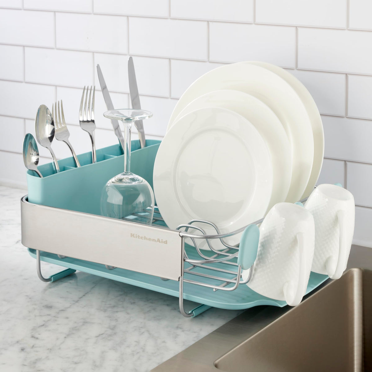 KitchenAid dish rack in use keeps cups and plates organized after meals.
