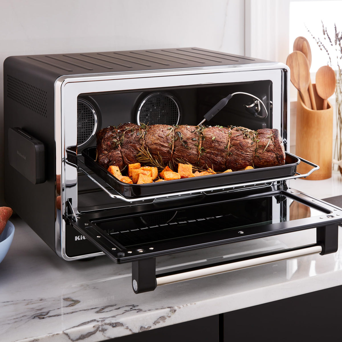 KitchenAid removable metal rack supports multiple dish heights for versatility.