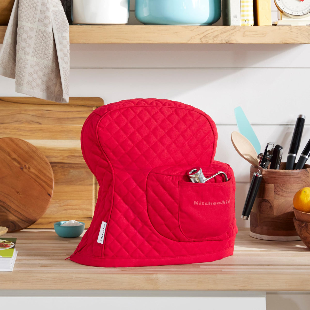 KitchenAid tilt-head cover front pocket stores attachments and recipe cards.