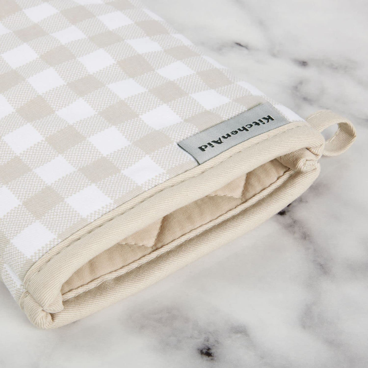 Close-up of KitchenAid Gingham oven mitt cotton texture and insulation