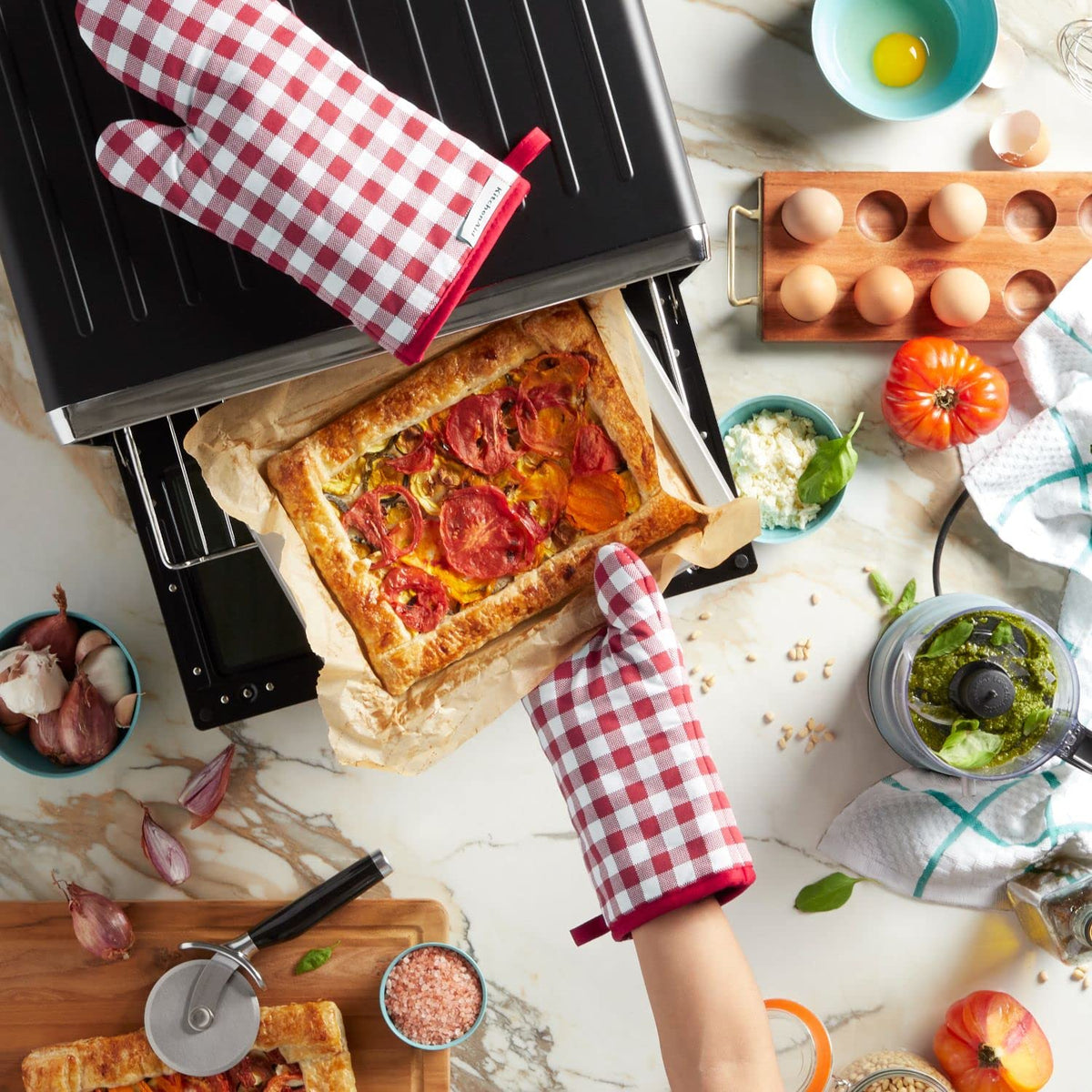 KitchenAid Gingham oven mitts are machine washable for quick cleanup.