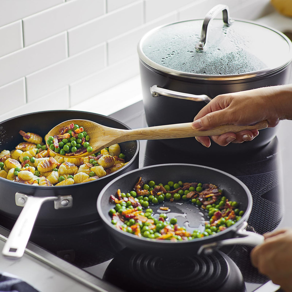 Extra-wide handles on KitchenAid stockpot and lids for a confident grip.