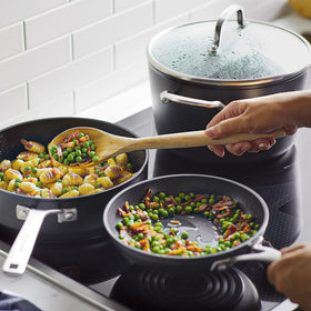 Extra-wide handles on KitchenAid stockpot and lids for a confident grip.