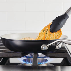 KitchenAid pan forged base detail highlighting fast, even heat conduction