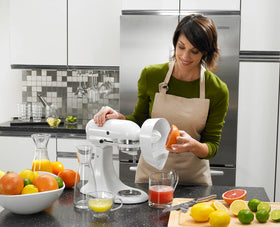 KitchenAid JE attachment mounted on a stand mixer in operation.