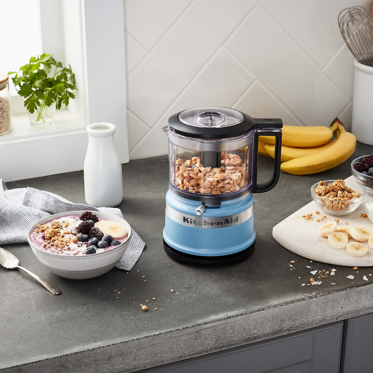 KitchenAid compact chopper with cord wrap for tidy countertop storage.