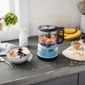 KitchenAid compact chopper with cord wrap for tidy countertop storage.