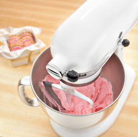KitchenAid KFE5T beater used in a typical kitchen scenario for improved mixing.